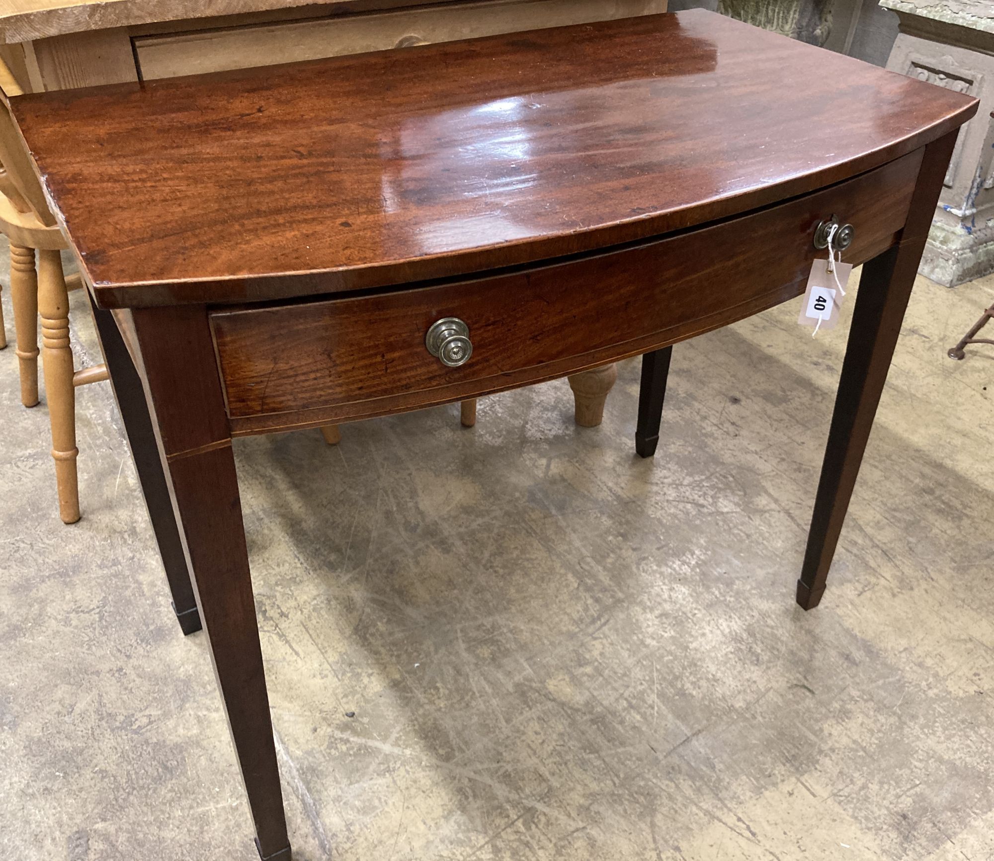 A George III mahogany bow front side table, width 84cm, depth 51cm, height 71cm